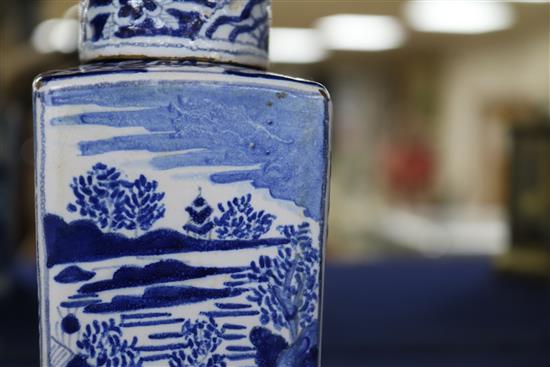 A pair of Dutch delft blue and white lidded tea caddies